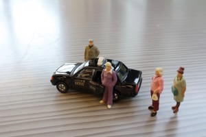 A,Small,Human,Figure,And,A,Japan,Taxi