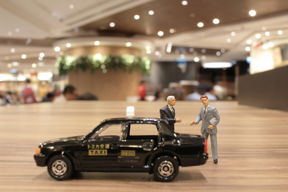 A,Small,Business,Figure,With,Japan,Taxi