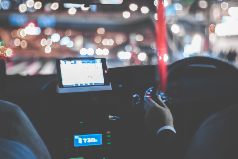 Blurred,Photo,Of,A,Taxi,Driver,In,Japan