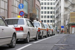 Row,Of,Some,Japanese,Cabs,In,A,Small,City,Street.
