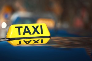 Luminous,Taxi,Top,Sign.,Taxi,Car,Sign,At,Day,Time,