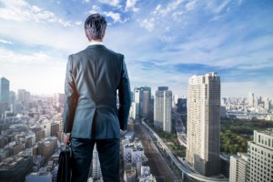 Businessman,Looking,Down,A,Modern,City.,Business,Prospect,Concept.