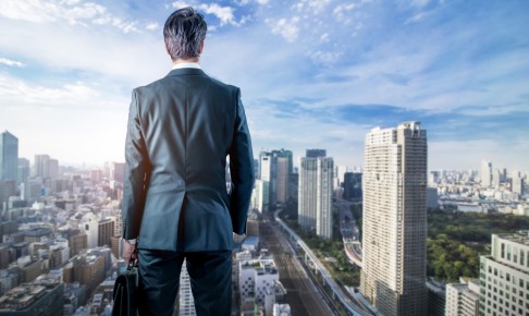 Businessman,Looking,Down,A,Modern,City.,Business,Prospect,Concept.