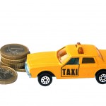 Taxi,Toy,And,Euro,Coins,Isolated