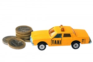 Taxi,Toy,And,Euro,Coins,Isolated